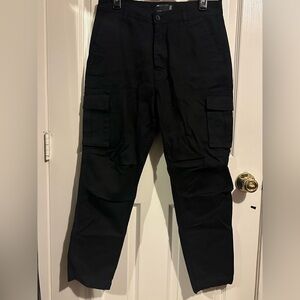 ASOS DESIGN tapered cargo pants in black with 3D pockets